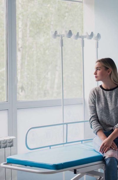 Full length portrait of a woman waiting for medical examination